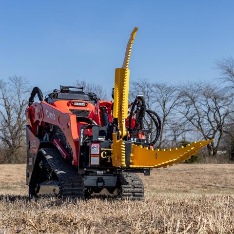 Intimidator CT mounted on mini-skid-steer with jaws and grapple open