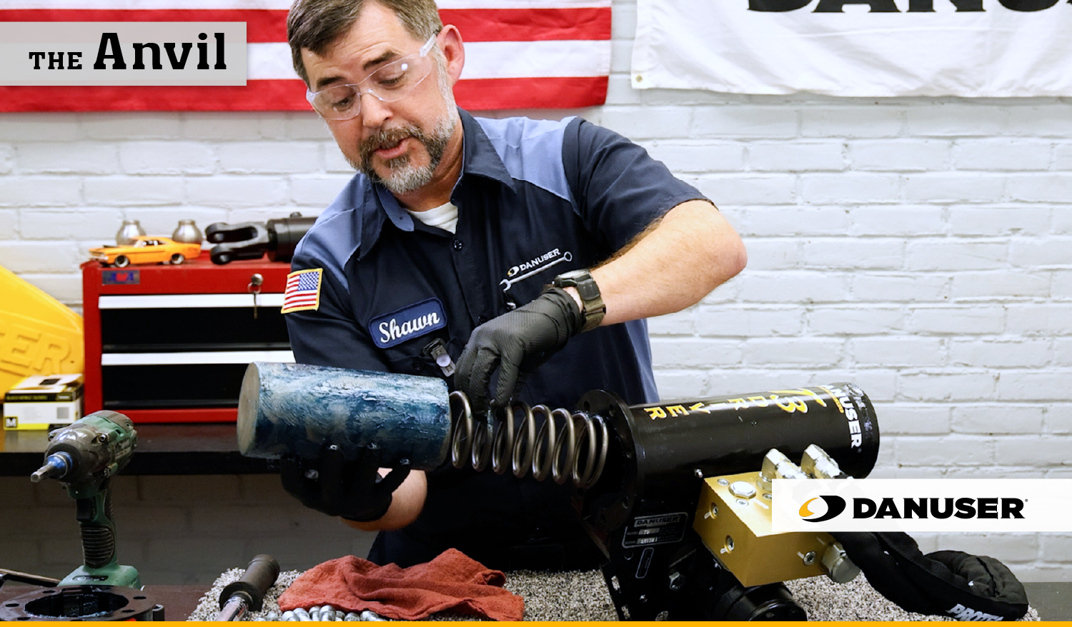 Danuser customer service representative showing the act of replacing the weight and spring in a T3 post driver