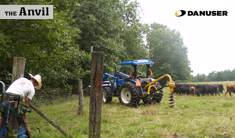 man fixing fence in the foreground with a Danuser PTO digger and cattle in the background